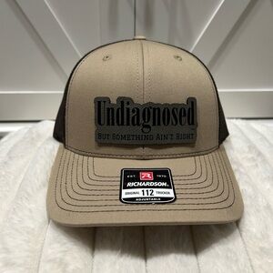 Undiagnosed, but something ain’t right. Richardson trucker hat.